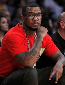 Rapper Jayceon Terrell Taylor, known by his stage name "Game" and "The Game", sits courtside as he watches the Lakers play the Rockets during their NBA basketball game in Los Angeles