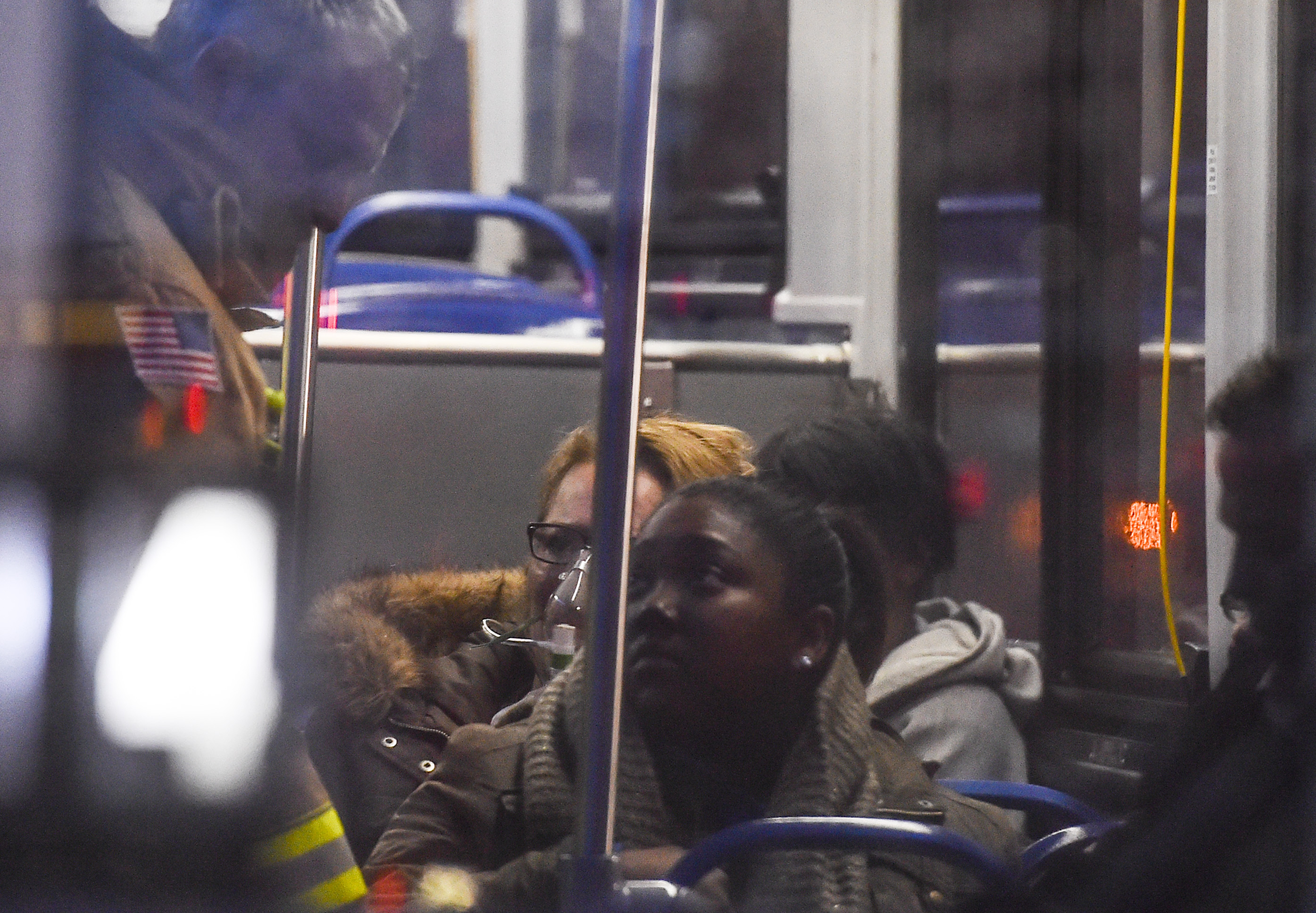 WASHINGTON, DC - JANUARY 12 : A firefighter assists a Metro pas