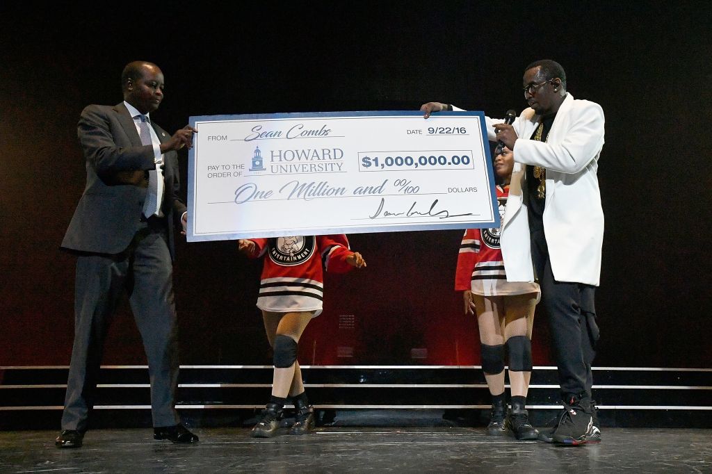 Sean 'Diddy' Combs Presents Howard University President Wayne A.I. Frederick With Special Donation Check