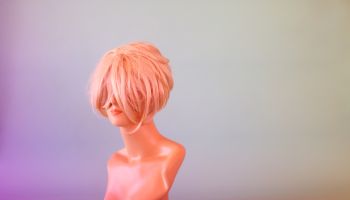 Mannequin Head Hiding Behind Blonde Wig