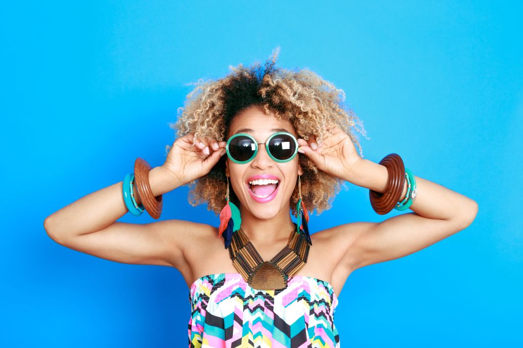 Summer portrait of excited afro american young woman