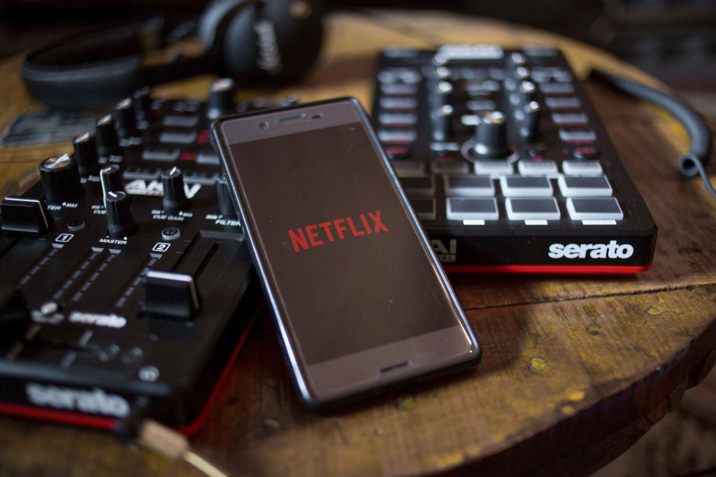 The Netflix app seen display on a Android smartphone with...