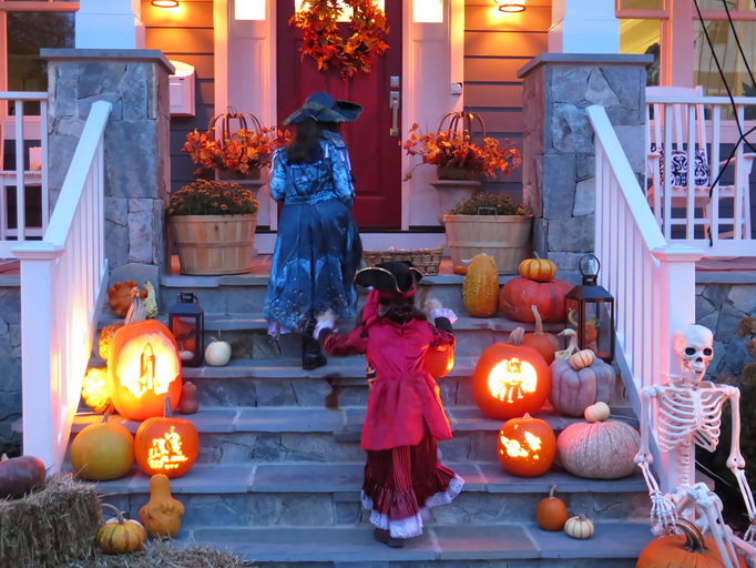 Two sisters in Pirate Costumes on Halloween trick or treating.