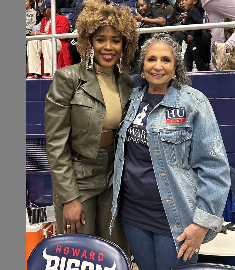 News Anchor Tashara Parker and Ms. H at Howard University vs. Morgan State University Men's Basketball Game