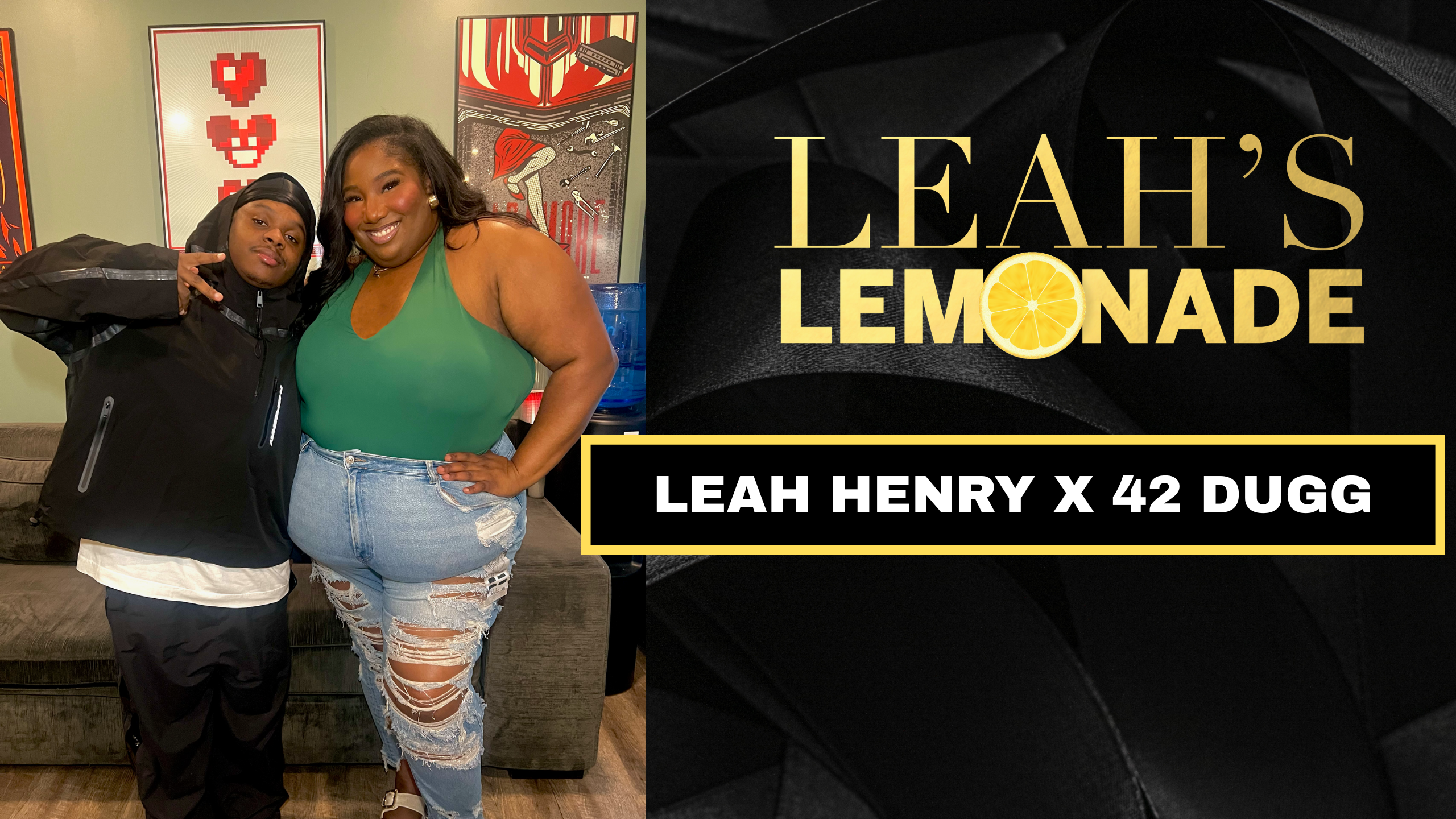 Two people, a woman and a man, posing together in front of artwork and a sign that says "Leah's Lemonade" and "Leah Henry x 42 Dugg".